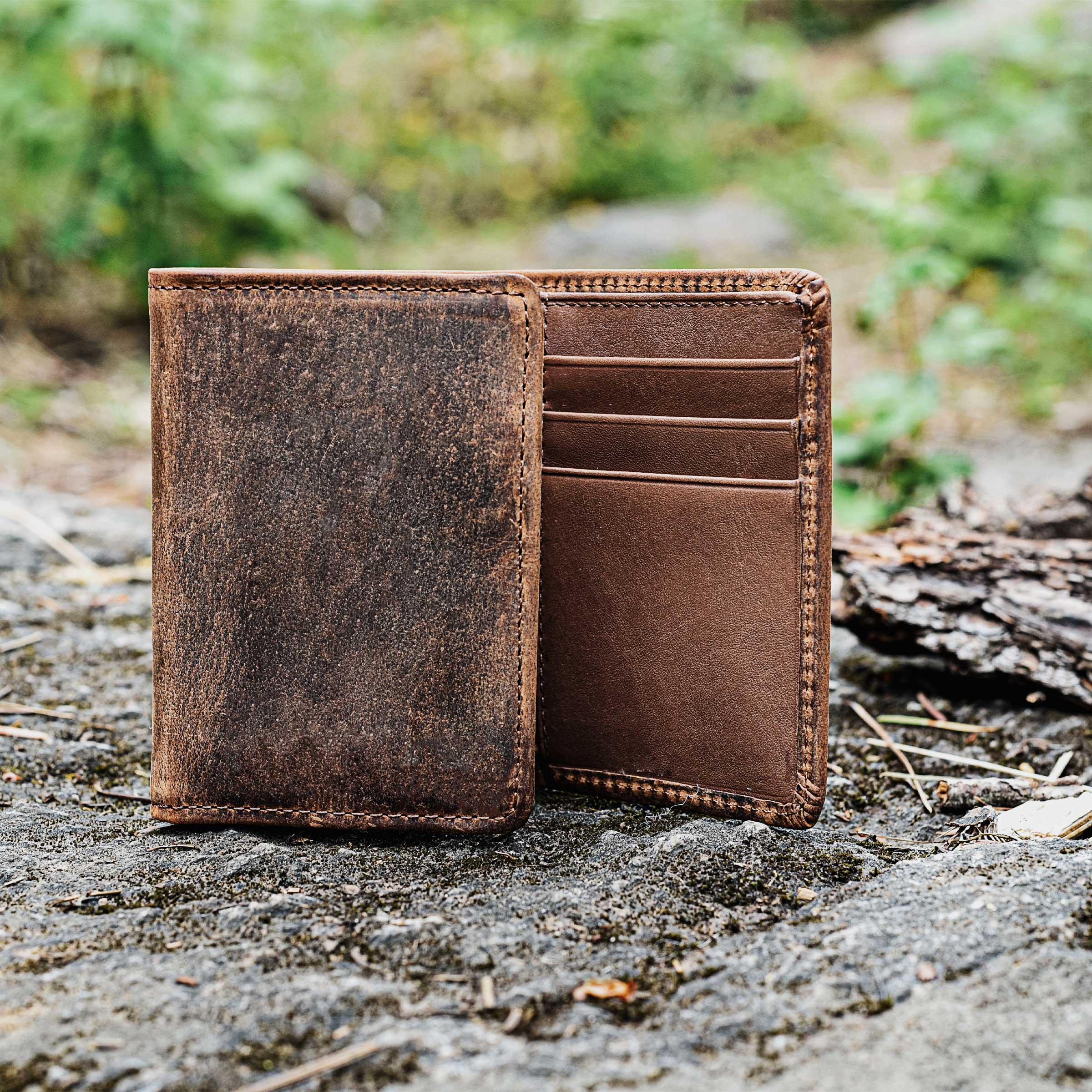 Brown Lejon Belts Phoenix tri-fold men's wallet open showing multiple card slots and cash compartments.