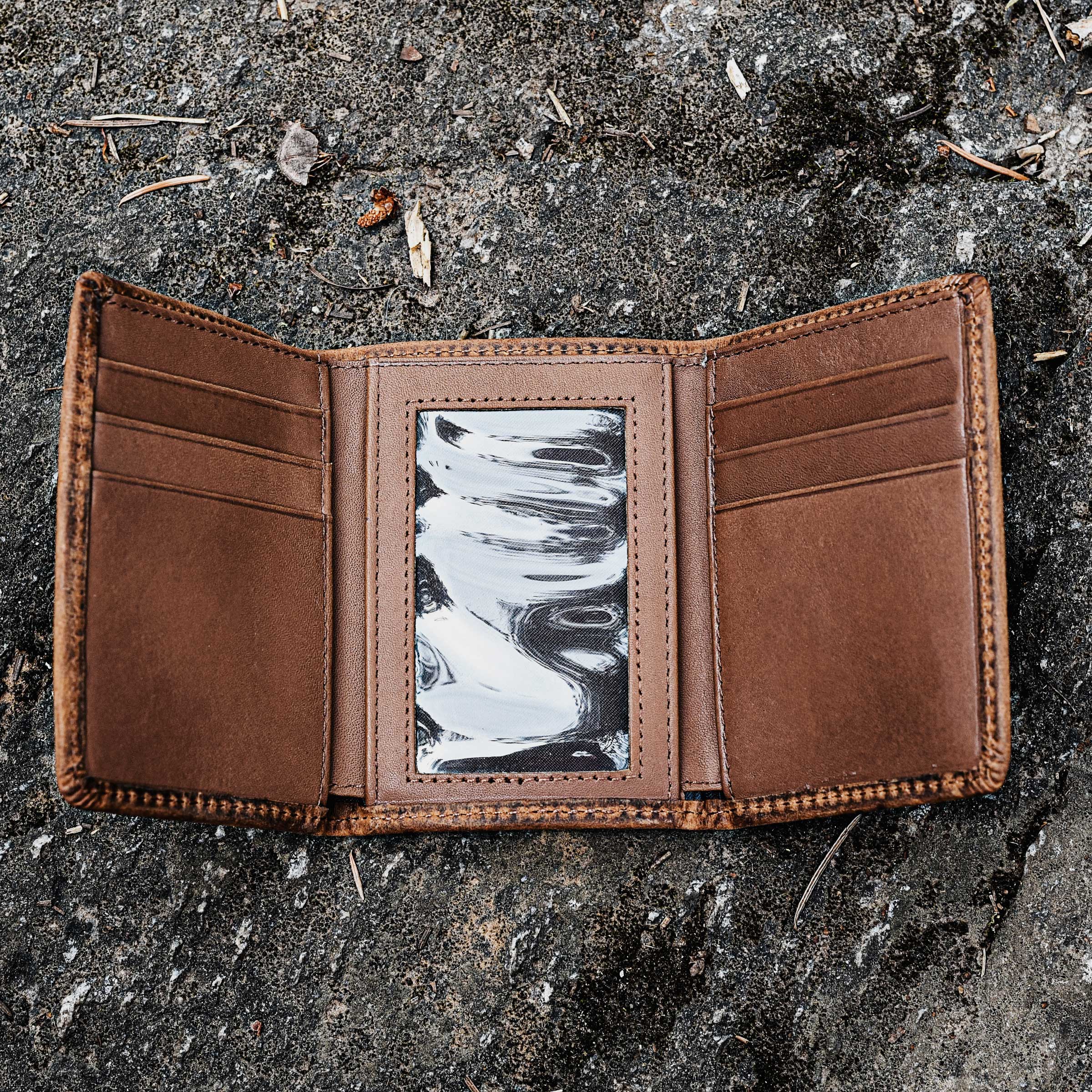 Brown Lejon Belts Phoenix tri-fold men's wallet with multiple card slots and bill compartments.